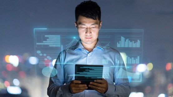 Young man using digital tablet