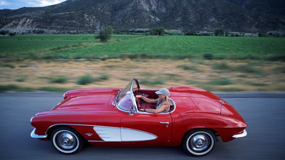 A younger driver in a collector car