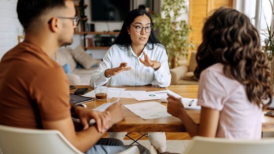 Young couple getting advice from financial expert