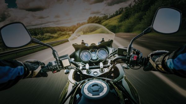 Open road close up of motorcycle dashboard